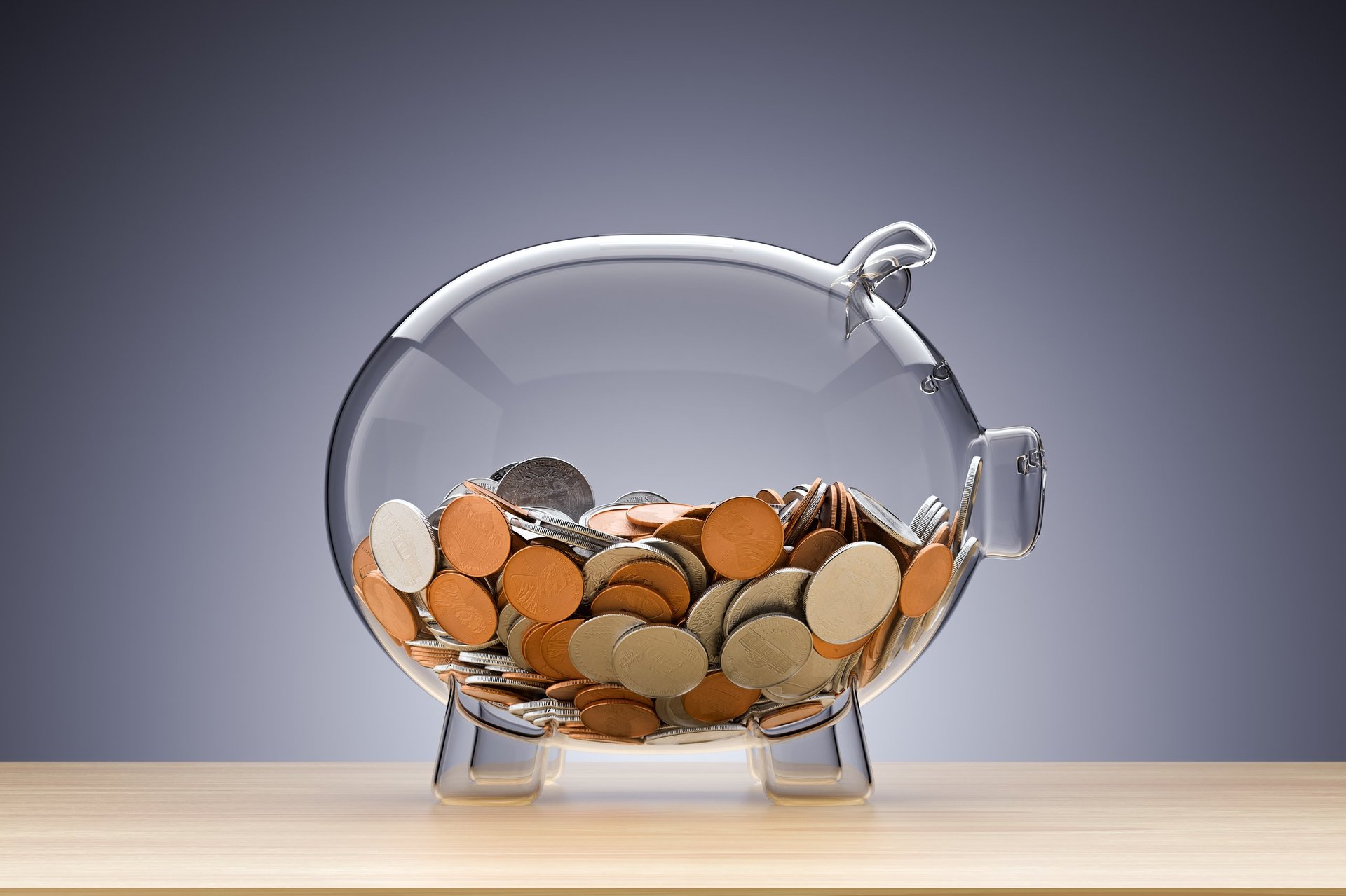 Glass piggy bank with coins